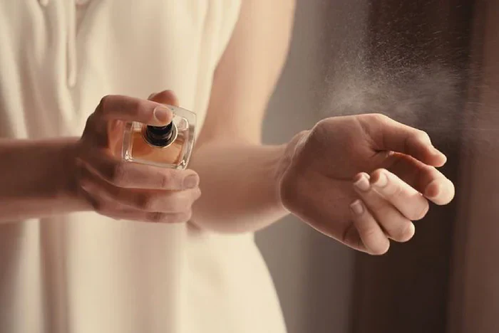 applying perfume